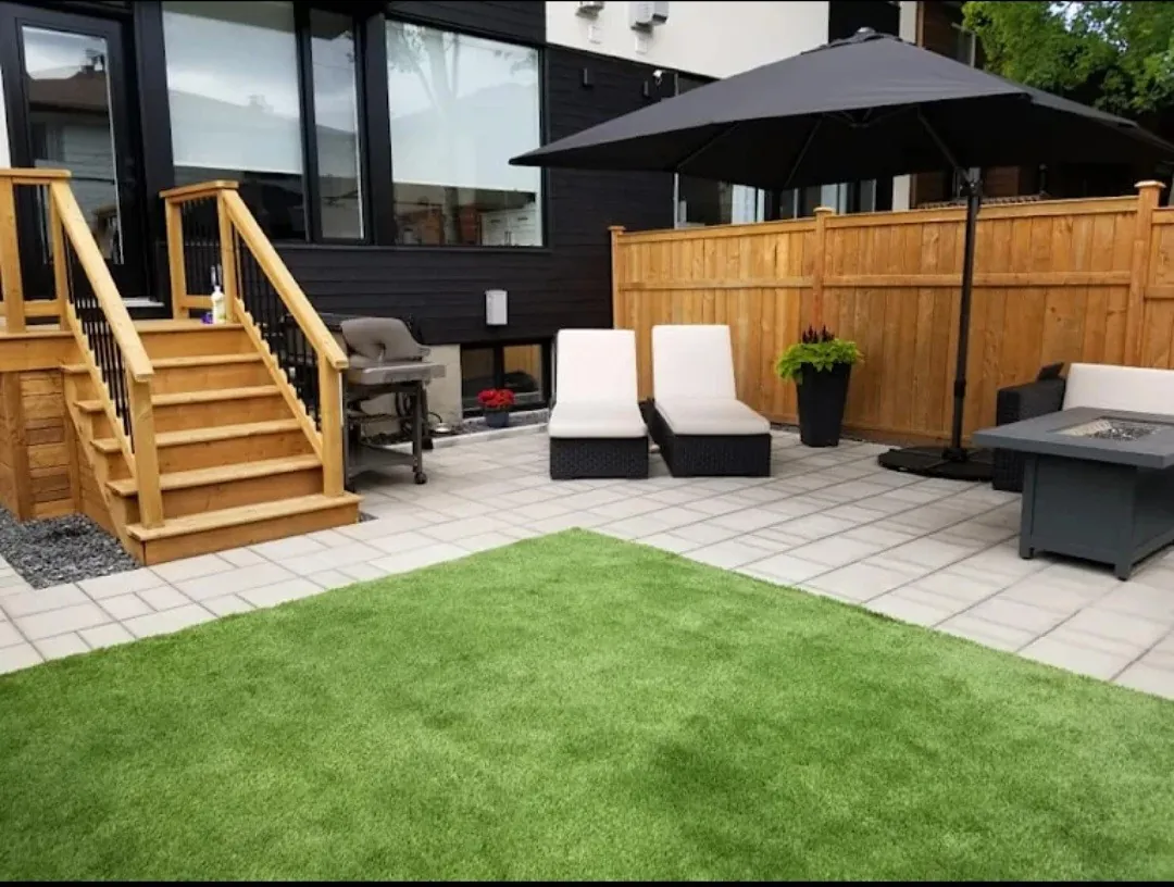 Full backyard makeover with artificial turf, porcelain patio, wood stairs and privacy fence in Etobicoke