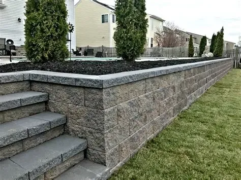 Segmental block retaining wall with built-in steps and a fresh lawn